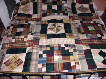 Woll patchwork quilt made from old plaid rugsPicture